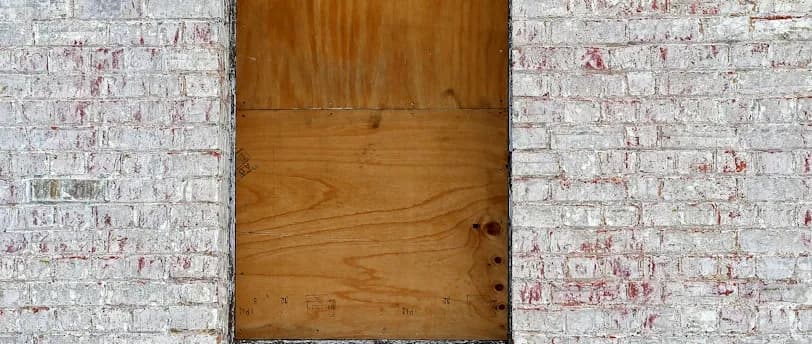 closed brown wooden window