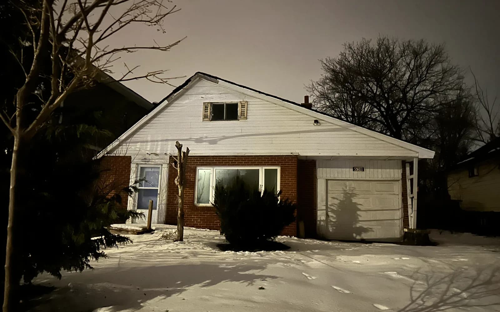 Brick bungalow with a wide lawn on a quiet family street in Tecumseh, Ontario